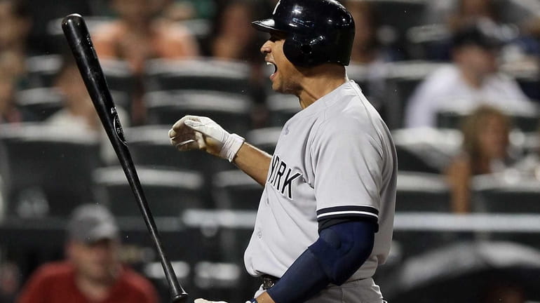 Alex Rodriguez reacts after he striking out in the eighth...