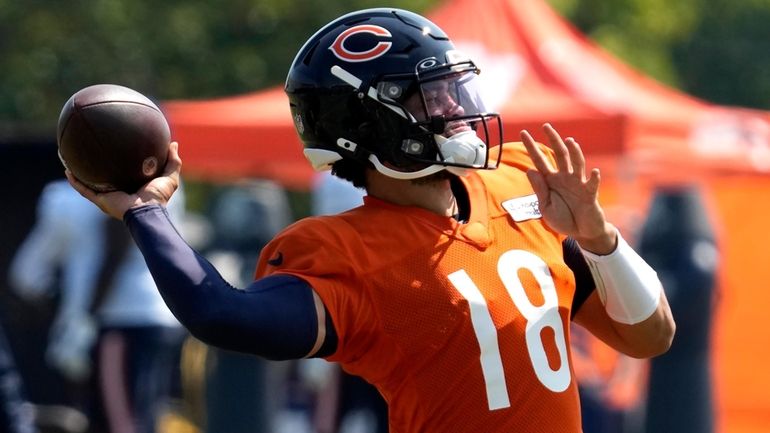 Chicago Bears quarterback Caleb Williams throws a ball during an...