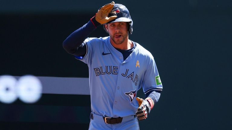 Toronto Blue Jays' Ernie Clement celebrates his solo home run...