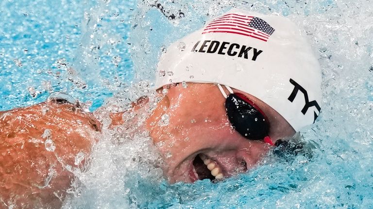 Katie Ledecky, of the United States, competes during a heat...