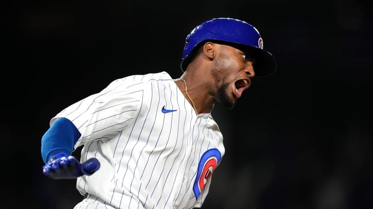 Canario's grand slam helps Cubs rout Pirates 14-1 to open half-game lead  for last wild card
