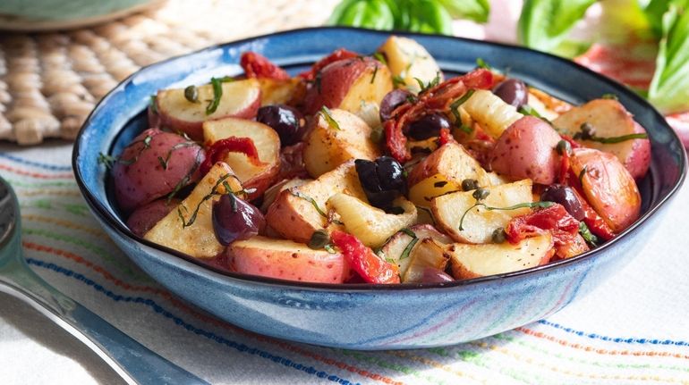 Potato salad made with fennel, olives, capers, sun dried tomatoes...