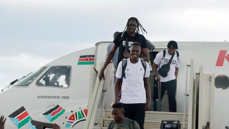 The South Sudanese basketball team arrive at Juba International airport,...