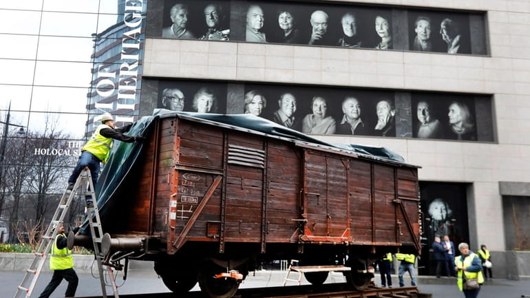 Portraits of Holocaust survivors are displayed at the Museum of...