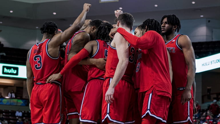 St. John's players celebrate their win over the Utah Utes...