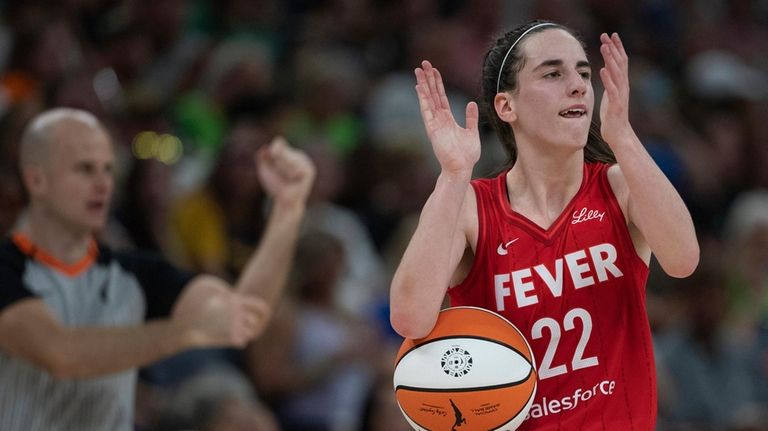 Indiana Fever guard Caitlin Clark (22) reacts to fans in...