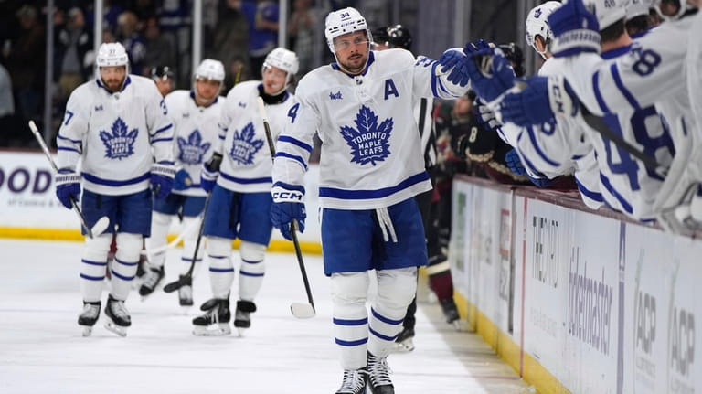 Toronto Maple Leafs center Auston Matthews (34) is congratulated after...