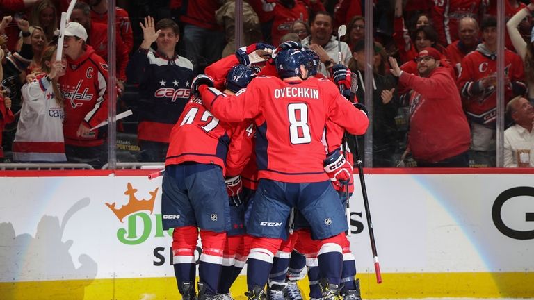 Washington Capitals left wing Alex Ovechkin (8) celebrates with teammates...