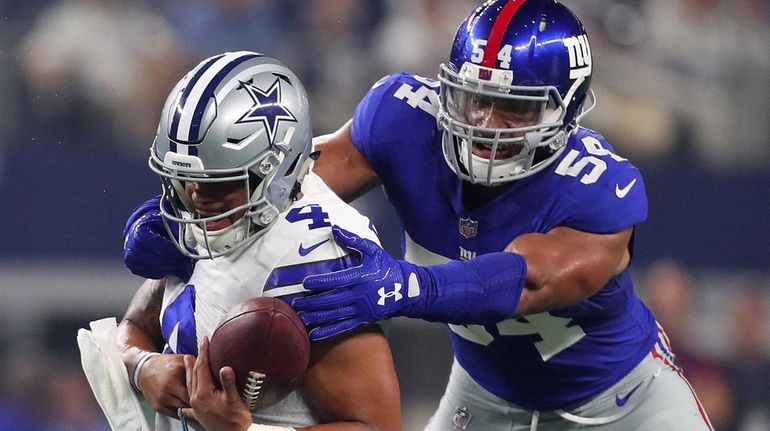 Giants defensive end Olivier Vernon (54) sacks Cowboys quarterback Dak...