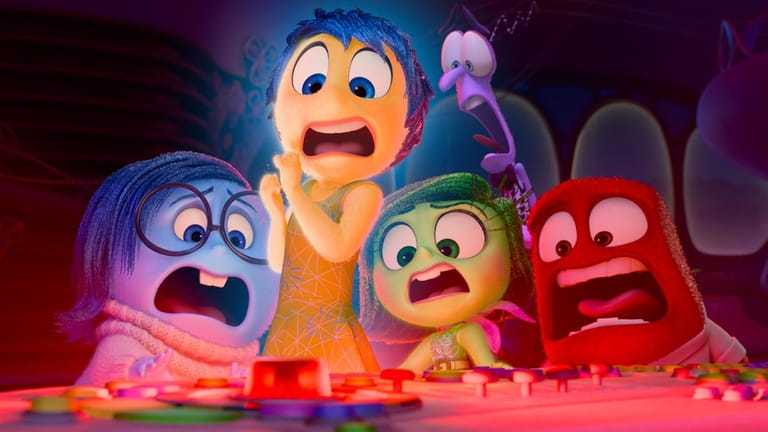 This image released by Disney/Pixar shows, from left, Sadness, voiced...