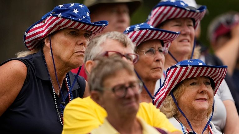 Fans watch from the 11th fairway during a Solheim Cup...