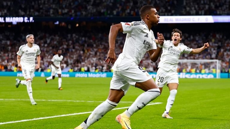 Real Madrid's Kylian Mbappe celebrates after scoring his sides first...