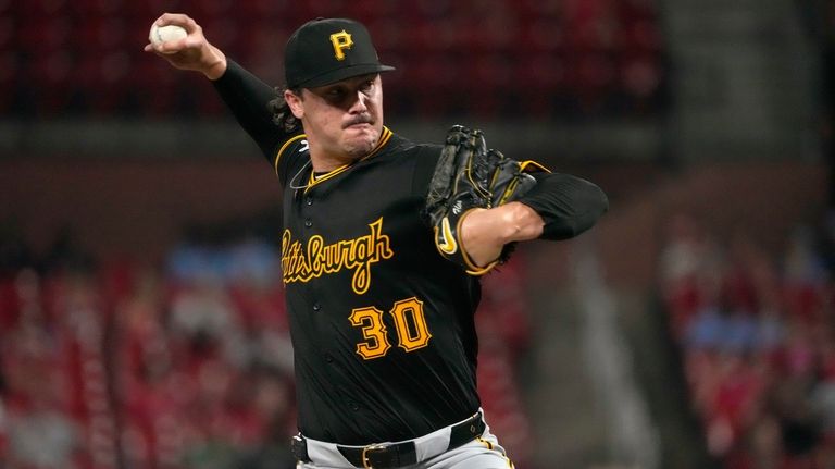 Pittsburgh Pirates starting pitcher Paul Skenes throws during the fourth...