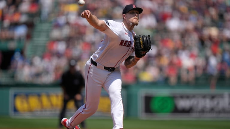 Boston Red Sox's Tanner Houck delivers a pitch to a...