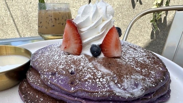 An order of "Ooh BAE Pancakes," ube pancakes with sea...