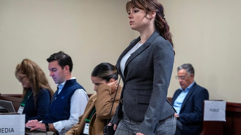 Hannah Gutierrez-Reed walks into court for the first day of...