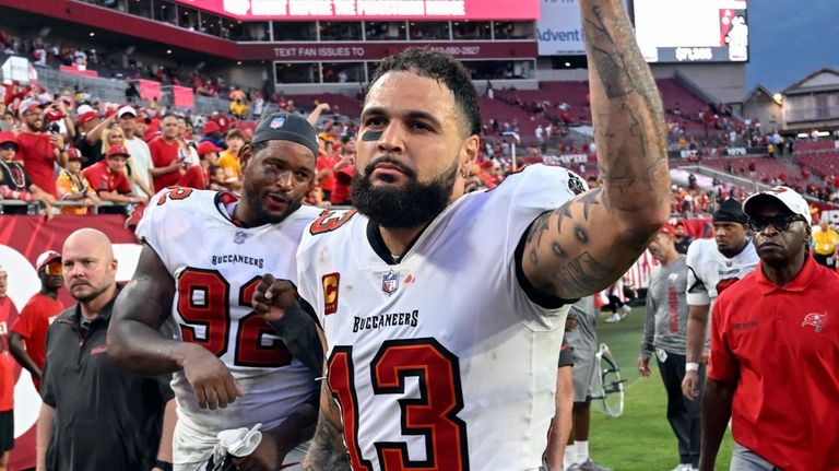 Tampa Bay Buccaneers wide receiver Mike Evans (13) acknowledges fans...