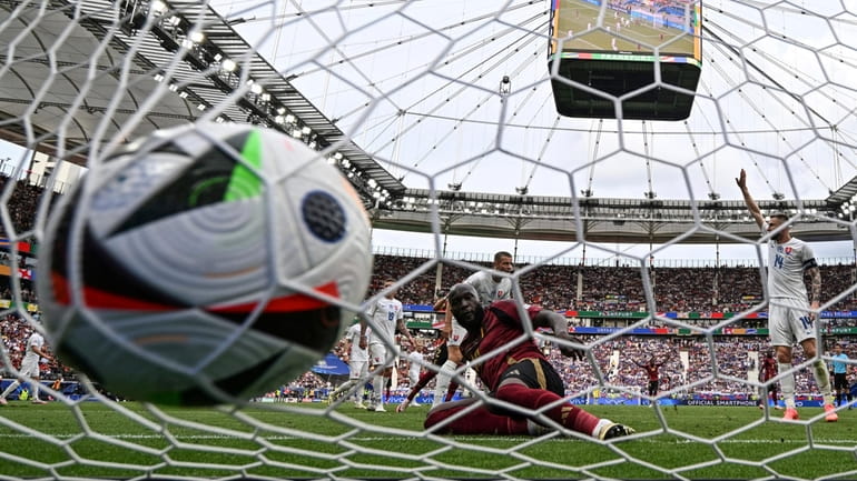 Belgium's Romelu Lukaku, front, scores a disallowed goal during the...