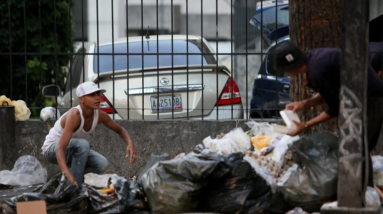 People look for food in the garbage due the extreme...