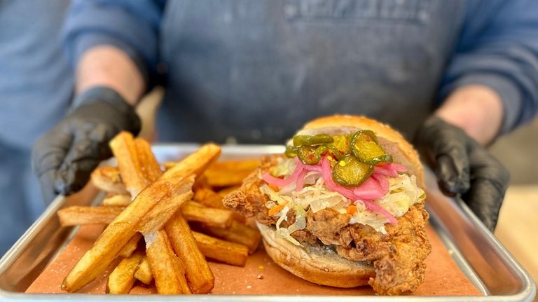 The fried chicken sandwich with candied jalapenos, pickled onion, vinegar...