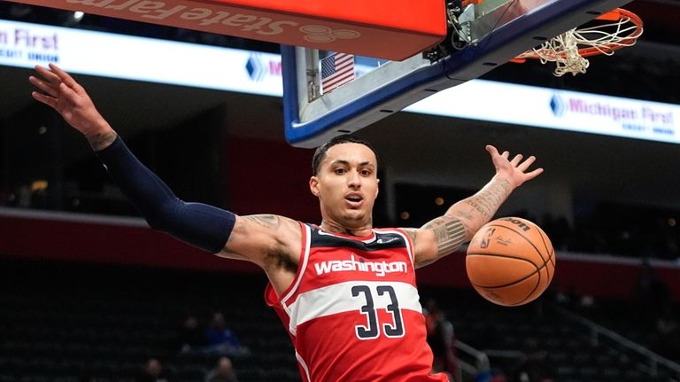 Washington Wizards forward Kyle Kuzma (33) dunks against the Detroit...