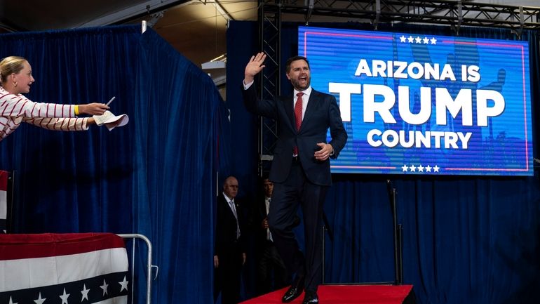 Republican vice presidential candidate Sen. JD Vance, R-Ohio, waves to...