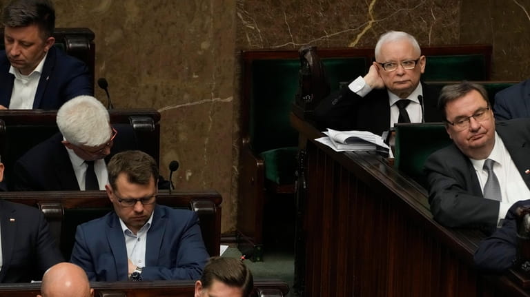Poland's ruling party leader, Jaroslaw Kaczynski, top right, during a...