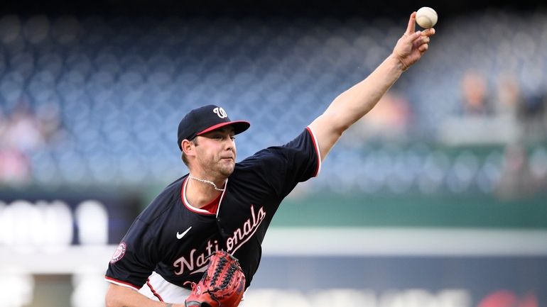 Washington Nationals starting pitcher Mitchell Parker throws during the first...