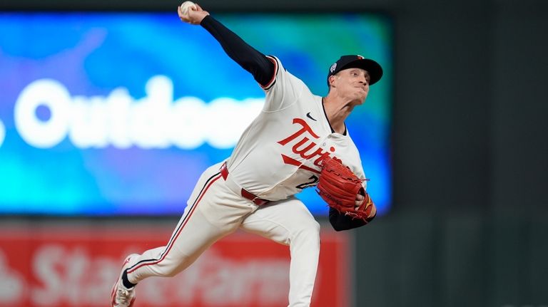 Minnesota Twins relief pitcher Griffin Jax delivers during the eighth...