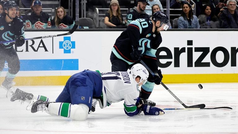 Seattle Kraken left wing Tomas Tatar (90) and Vancouver Canucks...