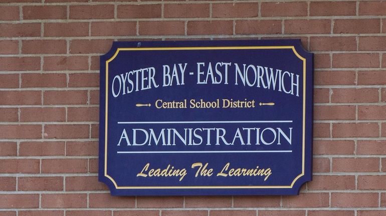 A sign outside the Oyster Bay-East Norwich Central School District's Administration...