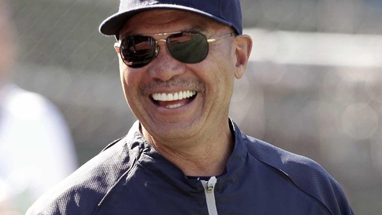 New York Yankees' Reggie Jackson smiles on the field before...