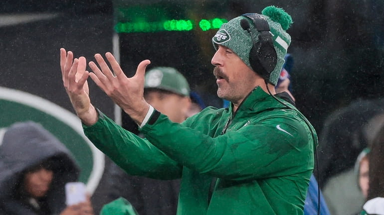 Jets QB Aaron Rodgers reacts to a call during the...