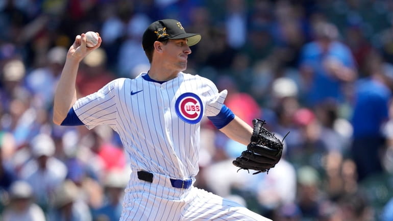 Chicago Cubs pitcher Kyle Hendricks delivers during the first inning...