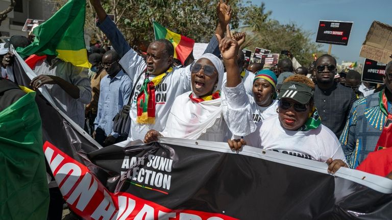 Supporters of the Aar Sunu Senegal opposition collective demonstrate on...