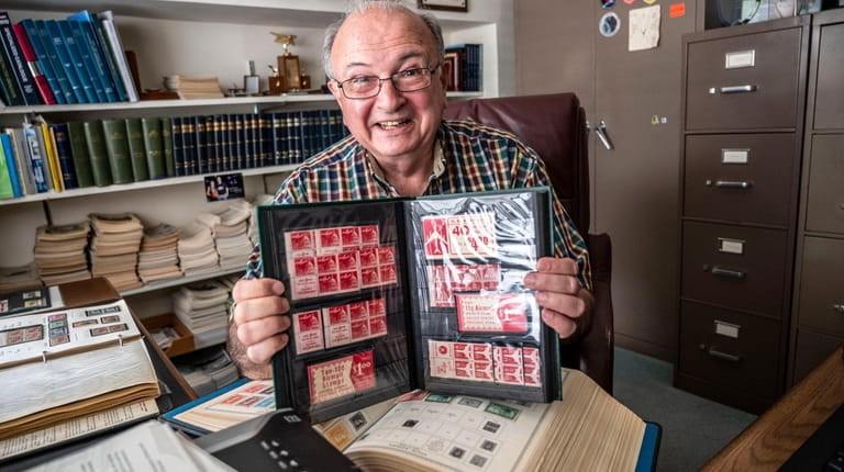 Steve Reinhard, seen with some of the stamps he's been...