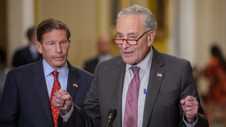 Sen. Richard Blumenthal, D-Conn., left, listens as Senate Majority Leader...