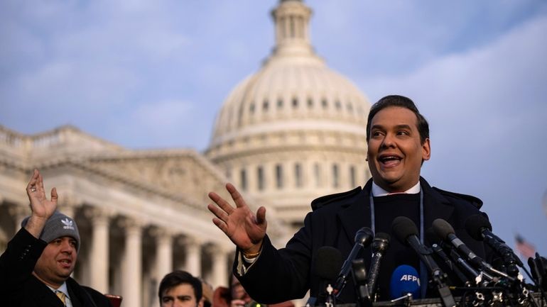 Rep. George Santos (R-N.Y.) talks to reporters outside the U.S....