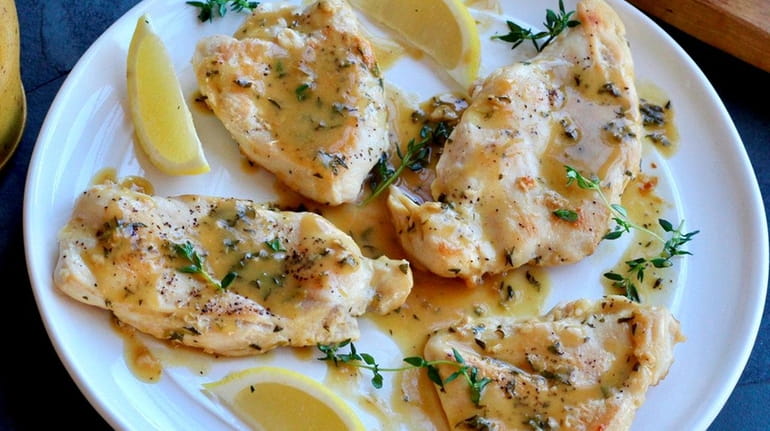 Boneless chicken breasts are cooked in a skillet and served...