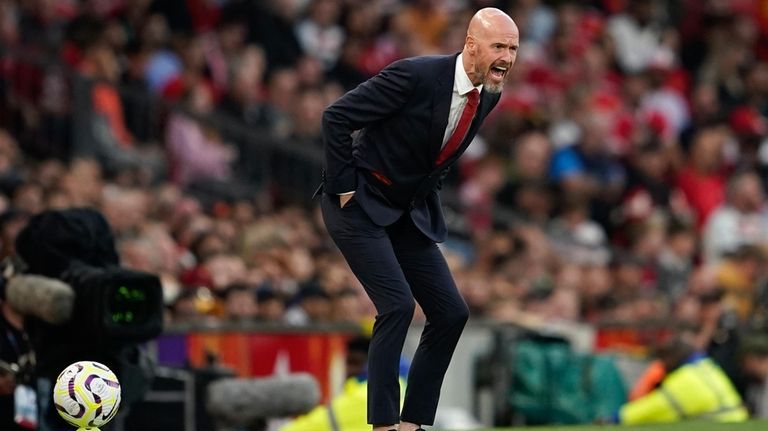 Manchester United's head coach Erik ten Hag shouts out from...