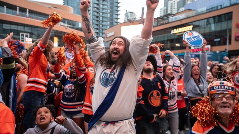 Edmonton Oilers fans celebrate as the Oilers defeated the Florida...