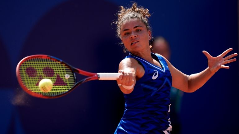 Jasmine Paolini of Italy returns the ball against Anna Karolina...