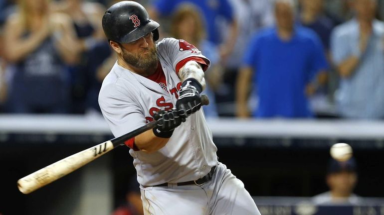 Mike Napoli #12 of the Boston Red Sox hits a...