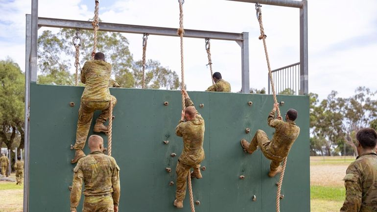 In this photo provided by the Australian Defense Force, students...