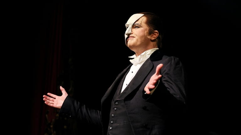 Ben Crawford as the Phantom during his curtain call at the 35th...