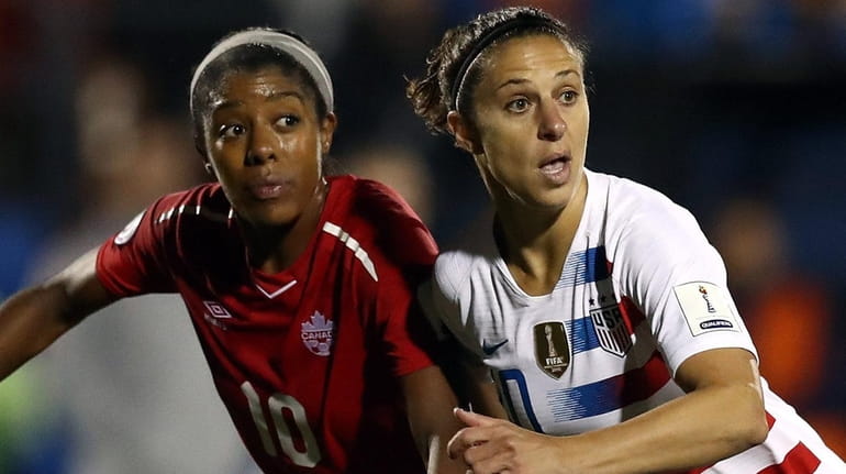 USA's Carli Lloyd and Canada's Ashley Lawrence during the CONCACAF...