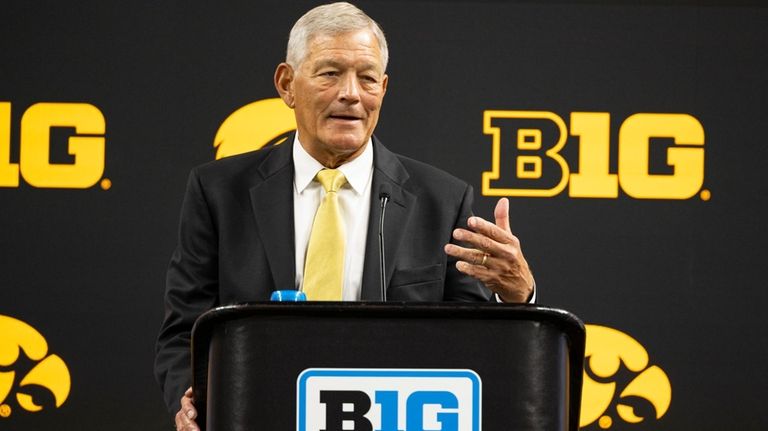 Iowa head coach Kirk Ferentz talks with reporters during an...