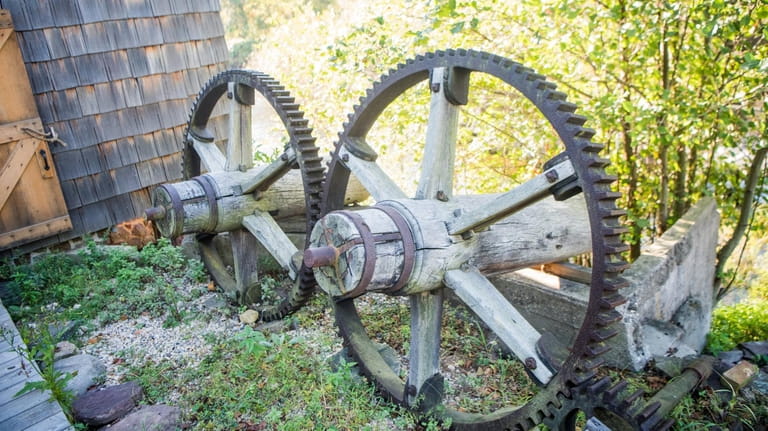Waterwheels rest outside Nicoll Grist Mill, built on land once...
