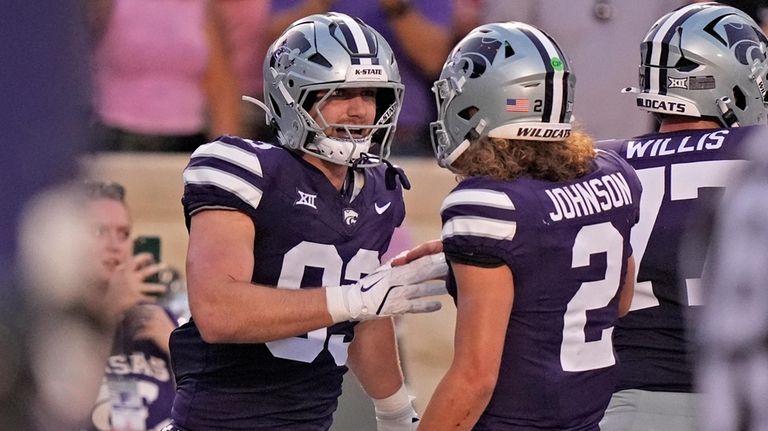 Kansas State tight end Will Swanson, left, celebrates with quarterback...