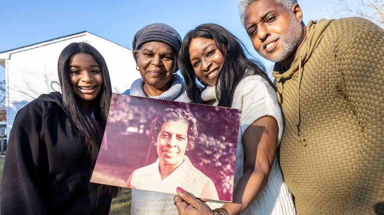 Tamika Mendoza holds a photo of her late grandmother Annie...